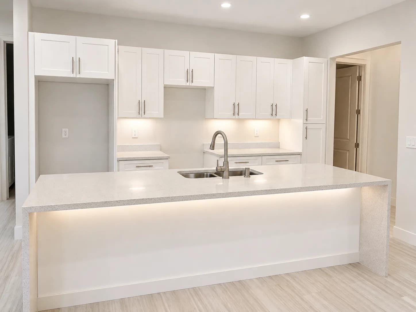 Clean white quartz countertop with integrated lighting